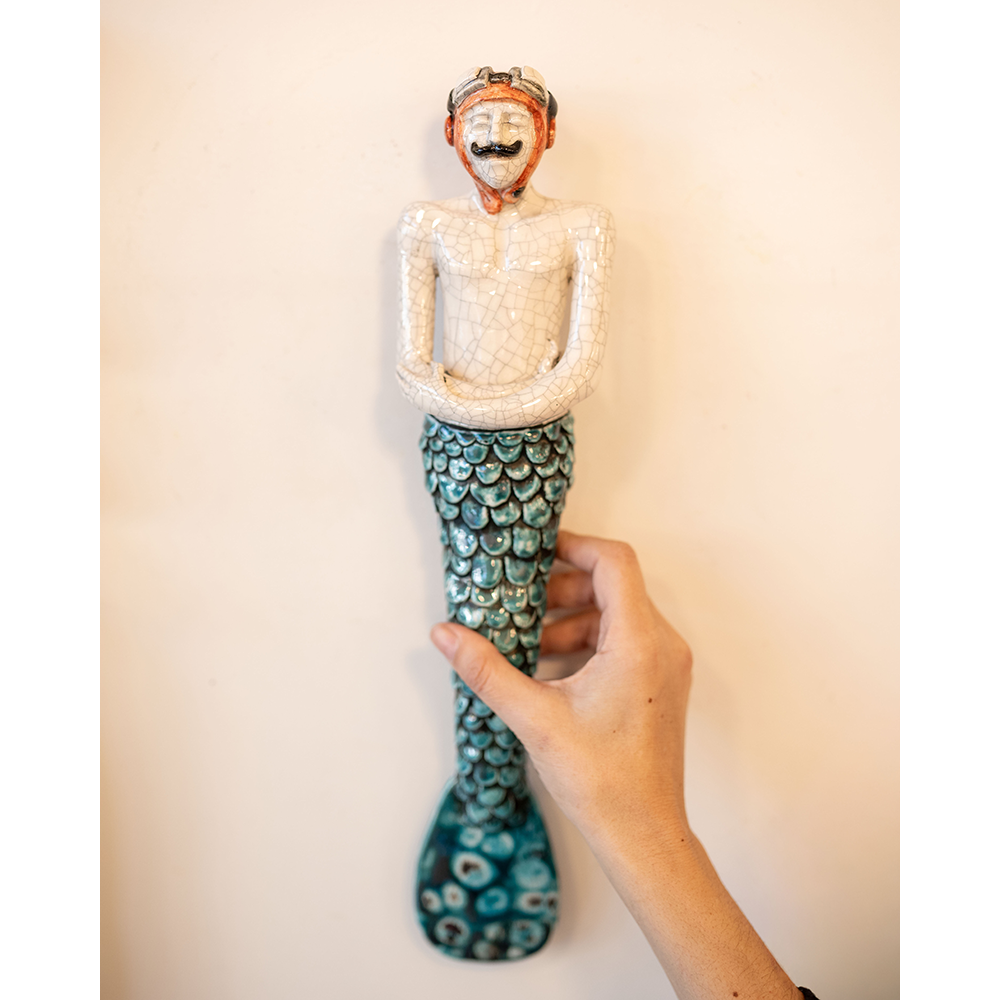 Gente com escamas · Tritão